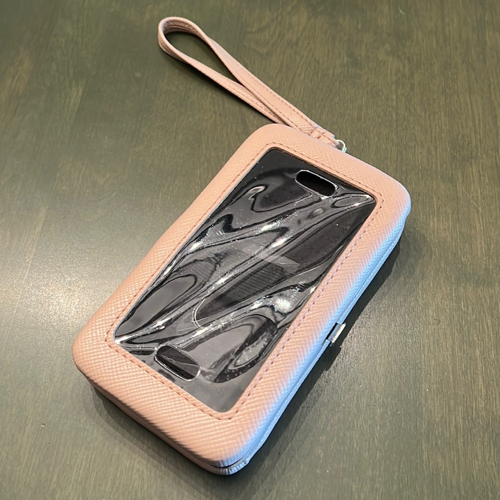 Very gently used wrist wallet/phone carrier.